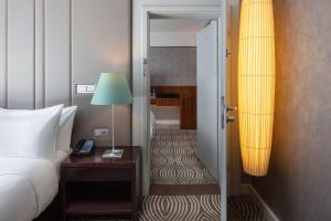 Postel nebo postele na pokoji v ubytování Hilton Berlin