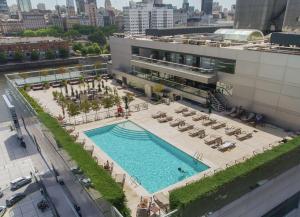 an overhead view of a swimming pool on a building at Hilton Buenos Aires in Buenos Aires