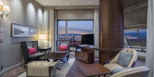 a living room with a view of a city at Hilton Bursa Convention Center & Spa in Bursa