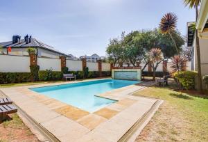 a swimming pool in the backyard of a house at Laru home in Germiston