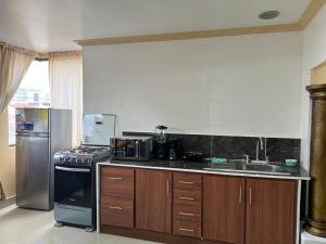 Köök või kööginurk majutusasutuses Hermoso y acogedor departamento