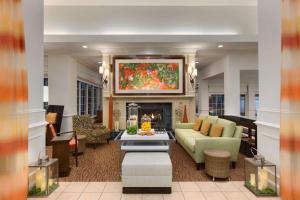 a living room with a couch and a fireplace at Hilton Garden Inn Fredericksburg in Fredericksburg