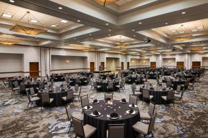 a large banquet hall with tables and chairs at Embassy Suites Dallas - DFW Airport North in Grapevine +37 photos
