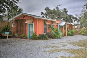 a row of houses on a gravel driveway at Walk to Beach from Chic Old Town Apartment with Yard in Bay Saint Louis