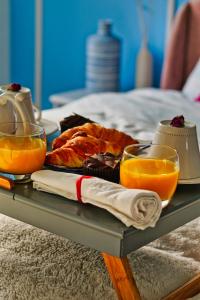 a tray of food and orange juice on a table at Duchess of Cambridge in Copdock