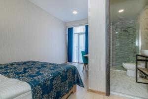 Uma cama ou camas num quarto em Vita Gardenia Hotel Tskaltubo