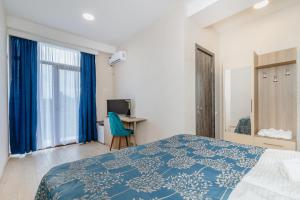 Uma cama ou camas num quarto em Vita Gardenia Hotel Tskaltubo