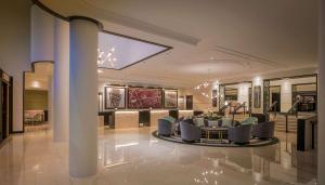 a lobby with a group of chairs and a table at Conrad Dublin in Dublin