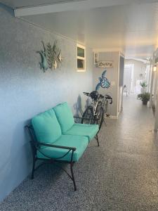 a room with a couch and a bike against a wall at Beautiful and comfortable rom apt # 2 in Tampa