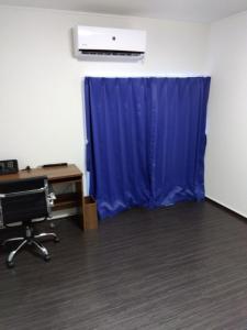 an office with a desk and a blue curtain at Tsunageru Aomori Yasukata - Vacation STAY 40732v in Aomori