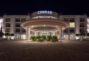 a view of a building at night at Conrad Algarve in Quinta do Lago