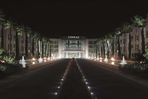 a view of a building at night with lights at Conrad Algarve in Quinta do Lago
