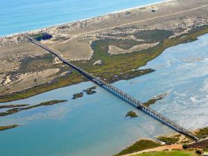 an aerial view of a bridge over a body of water at Conrad Algarve in Quinta do Lago