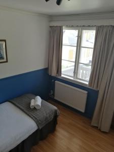 Postel nebo postele na pokoji v ubytování Lugnet Malung Hotell