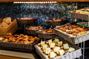a buffet filled with trays of food on display at Hilton Vilamoura in Vilamoura +93 photos