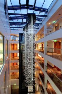 a water fountain in the middle of a building at Hilton Gdansk in Gdańsk