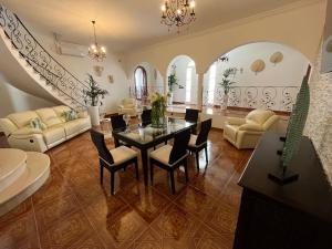 a large living room with a table and chairs at Casa Noa in Tuineje