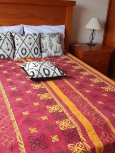 Katil atau katil-katil dalam bilik di Casa de 3 quartos em condomínio em Geriba