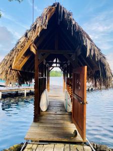 a small hut on a dock on the water at Dolphin Blue Paradise in Bocas del Toro