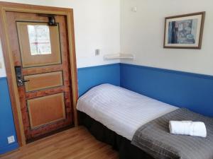 Postel nebo postele na pokoji v ubytování Lugnet Malung Hotell