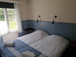 Postel nebo postele na pokoji v ubytování Lugnet Malung Hotell