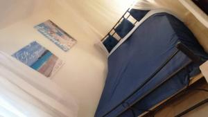 a bedroom with a blue bed in a room at Villa house Beach house N Hrakleia Xalkidikis No4 in Nea Irakleia