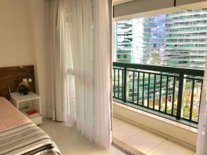 En eller flere senge i et værelse på F616 FJ Flat com WI-FI exclusivo em Região Central + 9 billeder