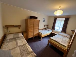 Un pat sau paturi într-o cameră la Hostel Postel