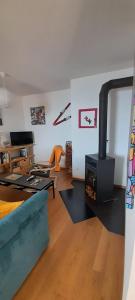 Posezení v ubytování Appartement CHENILLE charmant 2 pièces plein pied avec jardin et vue magnifique