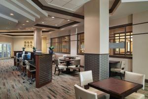 a lobby with tables and chairs in a building at Hilton Grand Vacations Club Paradise Las Vegas in Las Vegas