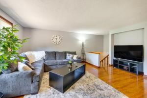 a living room with a couch and a tv at Bolivar Getaway Near Pro Football Hall of Fame! in Bolivar