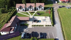 an aerial view of a house with cars parked in front at Pallos Apartments in Sovata