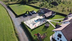 an aerial view of a house with a yard at Pallos Apartments in Sovata
