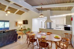 a kitchen and living room with a table and chairs at Greers Ferry Hideaway Lake View, Boat Ramp Access in Fairfield Bay