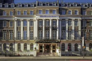 a large building with a balcony in front of it at Hilton London Euston in London