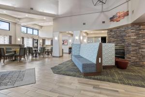 a lobby with a couch in the middle of a room at Hampton Inn & Suites Memphis-Wolfchase Galleria in Memphis