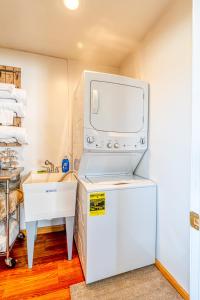 a kitchen with a white refrigerator and a sink at The Marysville Dome - Grannie House in Marysville