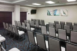 a room with rows of chairs and a podium at Hampton Inn & Suites Miami-Doral Dolphin Mall in Miami