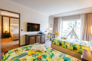 Postel nebo postele na pokoji v ubytování Hilton Munich City