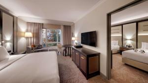 Postel nebo postele na pokoji v ubytování Hilton Munich City