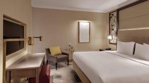Postel nebo postele na pokoji v ubytování Hilton Munich City