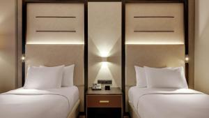 Postel nebo postele na pokoji v ubytování Hilton Munich City