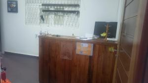 a wooden counter in a room with a window at Pousada e Hostel sol e mar in João Pessoa