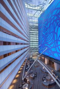a view of a building with tables and chairs at Conrad New York Downtown in New York