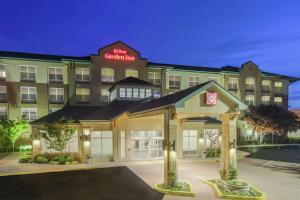 a rendering of the hotel colonial inn at night at Hilton Garden Inn Oakland/San Leandro in San Leandro