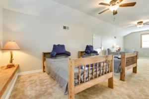 a bedroom with a bed and a living room at Bayou Bliss Barataria Waterfront Getaway with Dock! in Barataria