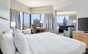 a hotel room with a large white bed and a large window at DoubleTree by Hilton Hotel Philadelphia Center City in Philadelphia +60 photos