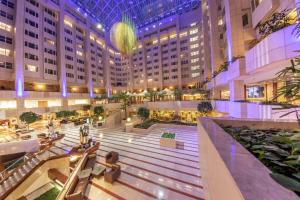 an empty lobby of a hotel with a large building at Hilton Prague Hotel in Prague