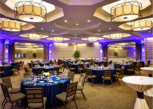 a banquet room with tables and chairs and purple lighting at DoubleTree by Hilton Hotel Philadelphia Center City in Philadelphia