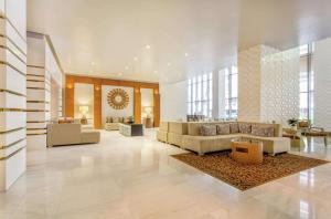 a large lobby with couches and a rug at Waldorf Astoria Panama in Panama City